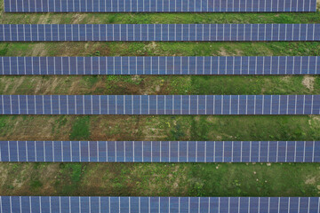 Aerial view of the huge solar power plant. Alternative clean green energy using renewable solar energy. Drone photo Solar panels in Europe, Hungary.