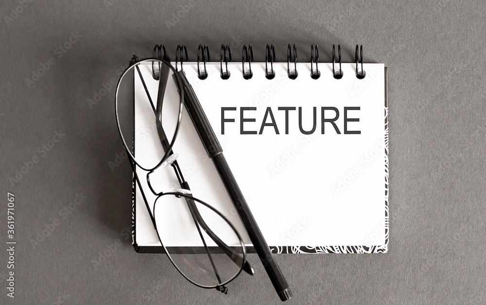Poster business concept - top view notebook writing feature on gray background