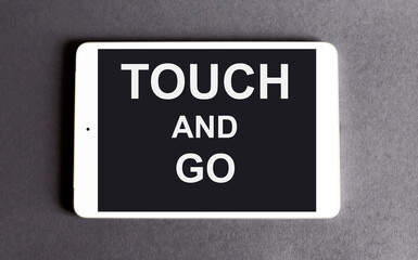 TOUCH AND GO concept - word on a digital tablet