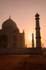 Fototapeta na wymiar A part view of the Taj Mahal’s main complex during sunrise in Agra