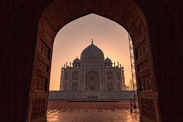 Fototapeta na wymiar A view of the Taj Mahal’s main building from arch of the mehman
