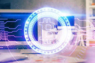 Multi exposure of blockchain theme hologram and table with computer background. Concept of bitcoin...