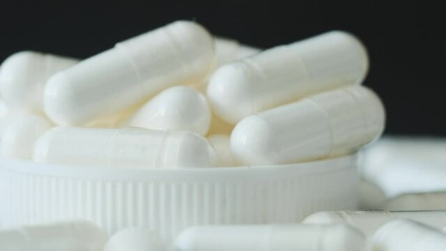 Dietary supplement pills in gelatin cover, close up
