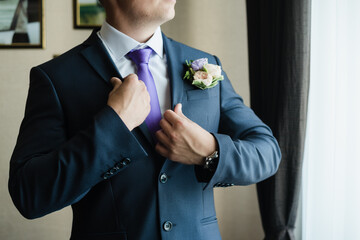 man in a jacket, groom straightens his jacket, groom's fees