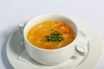 Vegetable soup served in white bowl