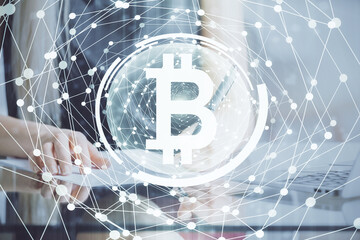 Cryptocurrency hologram over woman's hands writing background. Concept of blockchain. Multi exposure