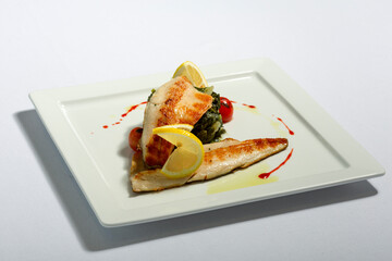 Fish fillet with cooked potato and greens