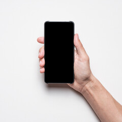 Hand holding mockup phone and show black isolated blank screen. Square