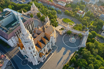 The Church of the Assumption in Buda, also known as the Matthias Church, is located in the Fisherman's Bastion, in the Holy Trinity Square. Monument. drone shot from above. Budapest, Hungary - 2020.