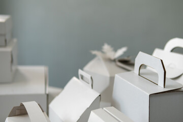 Different design and shape of cardboard boxes, paper containers. The concept of production and development of packaging. Industry. Place for text. selective focus