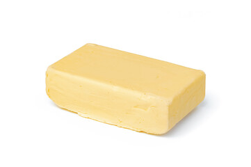 Block of butter isolated on white background