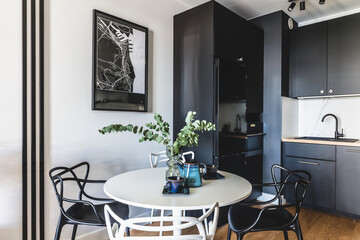 Kitchen in a modern studio apartment for rent. Interior design.