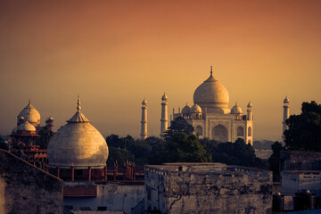 The magnificent Taj Mahal in India shows its full splendor at a glorious sunrise. - Powered by Adobe