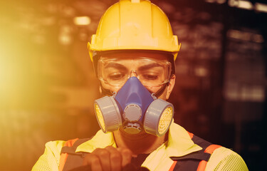 Engineers man wear protective masks to work in the factory. - obrazy, fototapety, plakaty