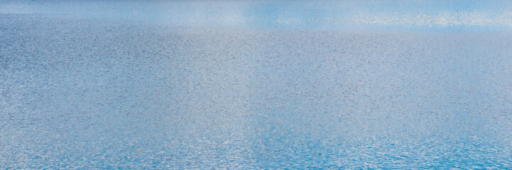 Abstract beautiful blue water surface on lake.