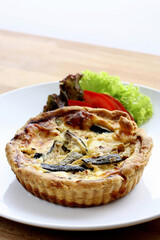 Quiche and vegetables on a plate