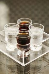 Carbonated drinks in shot glasses