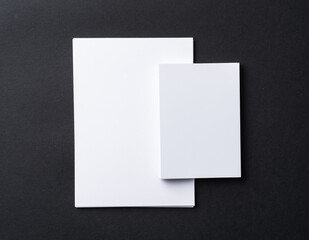 White blank business cards on dark black background