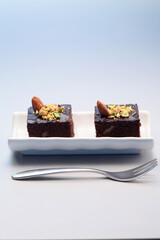 Brownie with almond and pistachio nut toppings