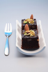 Brownie with almond and pistachio nut toppings
