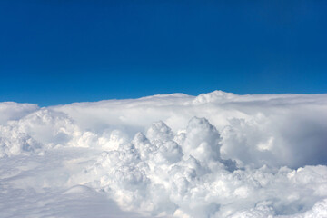 From a Window Clouds. Cockpit view from the aircraft. Sky. White fluffy clouds. Облака. Небо.