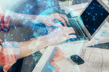 Businessman with computer background with brain theme hologram. Concept of brainstorm. Multi...