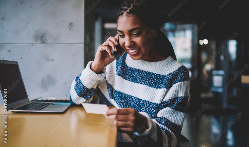 Poster happy smiling woman dialing number on modern telephone gadget from business card reading name of com