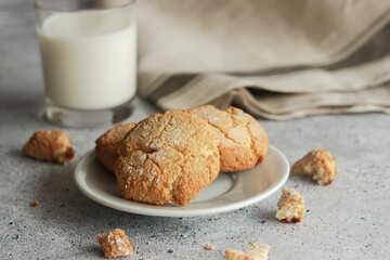 Tasty almond cookies with milk. Cookies on a plate