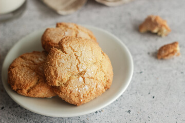 Tasty almond cookies with milk. Cookies on a plate
