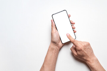 Mobile phone with isolated blank white screen on gray background. Male hands holding modern smartphone and pointing with finger. Template for marketing and advertising, flyer, banner