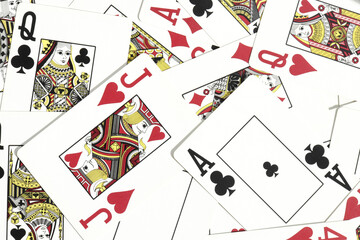 Mixed playing cards background. Assorted play cards backdrop. Many miscellaneous jumbled playing...