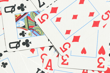 Mixed playing cards background. Assorted play cards backdrop. Many miscellaneous jumbled playing...