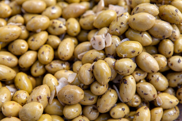 Green olives with garlic in closeup