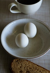 Obraz na płótnie Canvas Healthy breakfast. Boiled eggs, bread and coffee