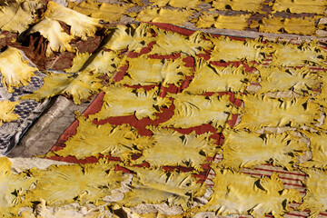 Drying dyed leather on rooftops, in a traditional leather tannery in Old Fez, vats for tanning and...