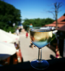 Summertime. Relaxing time with a glass of delicious dry white wine.