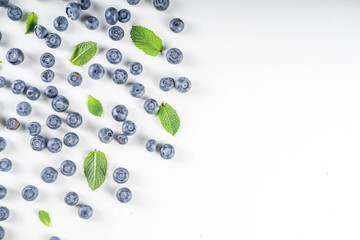 Flatlay pattern with fresh ripe blueberries on white background