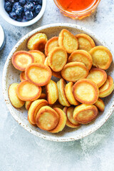 mini pancakes cereal delicious dessert breakfast Menu concept serving size. food background top view copy space for text organic healthy eating