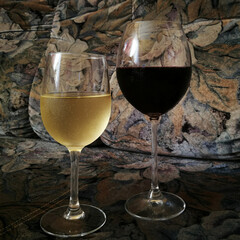 Glasses dry red and white wine like as a still life.