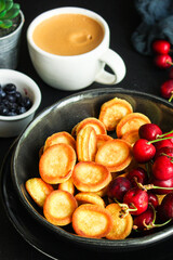mini pancakes cereal delicious dessert breakfast Menu concept serving size. food background top view copy space for text organic healthy eating