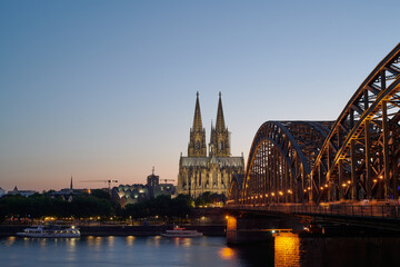 Fototapeta na wymiar Cologne Skyline with Cologne Cathedral and Hohenzollern Bridge at after sunset