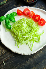 zucchini and tomato vegetables salad snack Menu concept serving size. food background top view copy space for text organic healthy eating raw keto or paleo diet