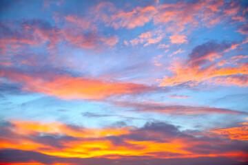 Naklejka na ściany i meble Clouds like heavenly fire . Evening sky with clouds in the twilight