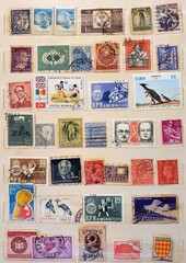 many old stamps on a philately catalog page 02.Jul.2020 in Sovata city - Romania