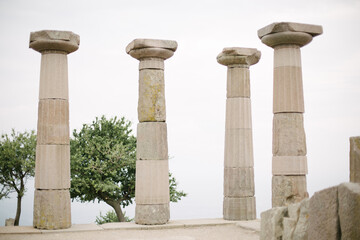 Temple of Athena. Coupons made of stone. The columns of the temple. Historical temple and ruins.