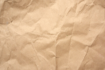crumpled blank sheet of brown wrapping kraft paper, vintage texture for the designer