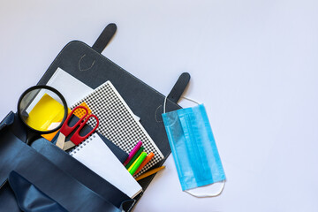 School supplies on the white background with copy space.