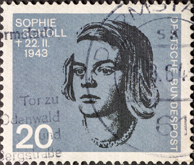 a postage stamp showing a portrait of Sophie Scholl, a member of the resistance against Adolf...
