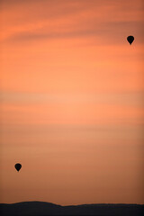 Hot air balloons in the sky during sunrise at Masai Mara, Kenya