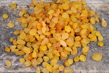 Raisins on a wooden background. View from above.